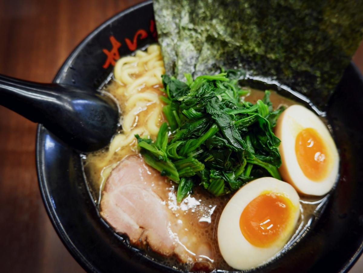 A bowl of ramen, marinated eggs and chashu